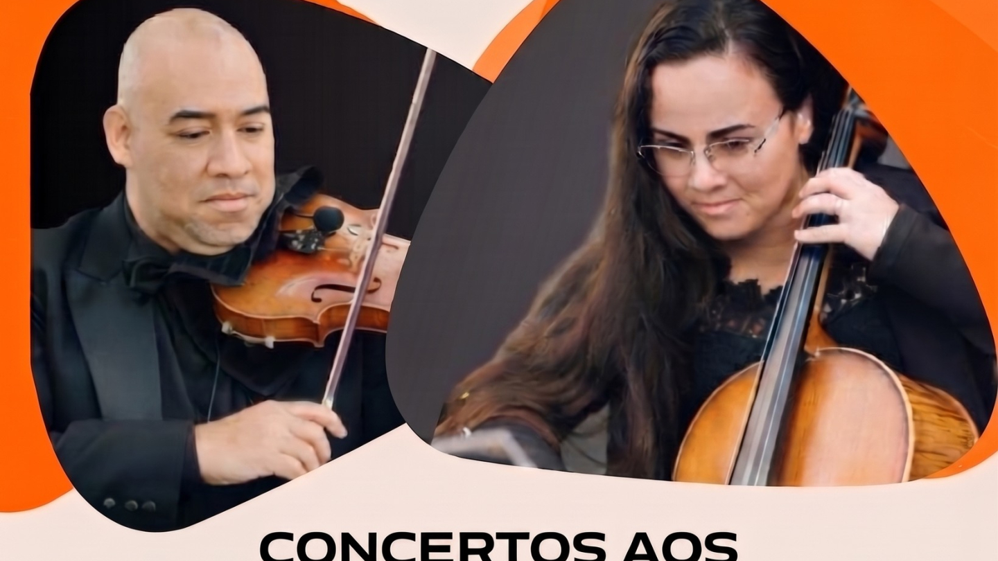 Cartaz de divulgação da série "Concertos aos Domingos", promovida pela Fundação Pinacoteca Benedicto Calixto. A arte destaca dois músicos em apresentação: à esquerda, um violinista de traje social tocando violino; à direita, uma violoncelista concentrada durante a execução da peça. O cartaz informa que o concerto "Fabiano Carmello e Orquestra" acontece no dia 26 de julho, às 10h30, no Salão Nobre da Pinacoteca Benedicto Calixto, com entrada gratuita.