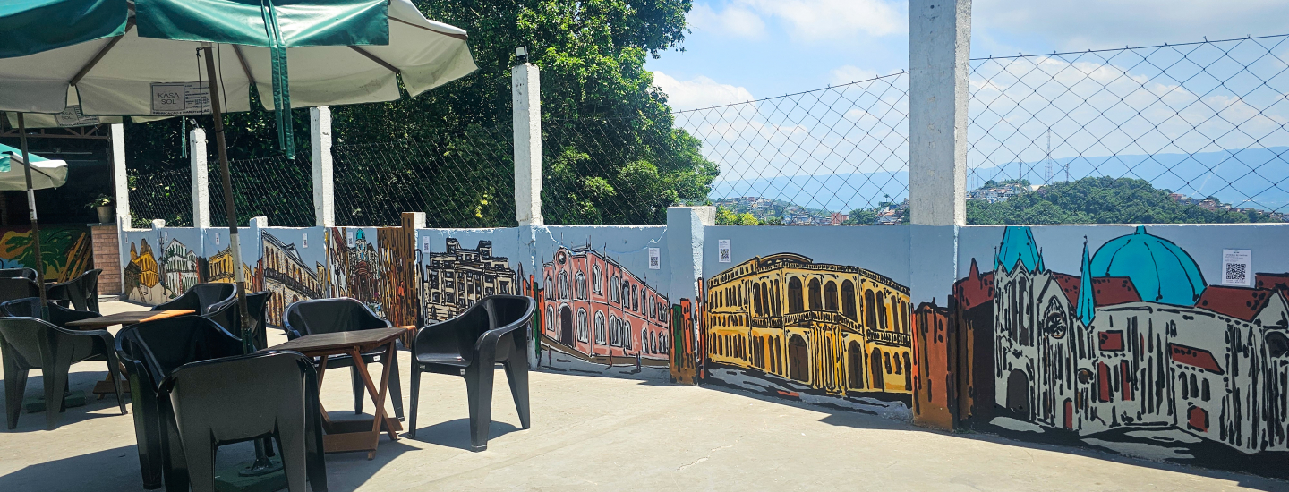 Mural colorido do artista Preö, que retrata diversas construções de Santos