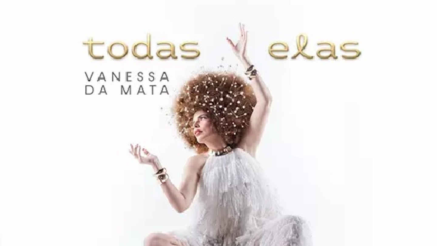 Cartaz do show "Todas Elas" de Vanessa da Mata, que mostra a cantora sentada com os braços erguidos. Ela usa um vestido branco e seus grandes cabelos crespos estão adornados com pequenas luzes.