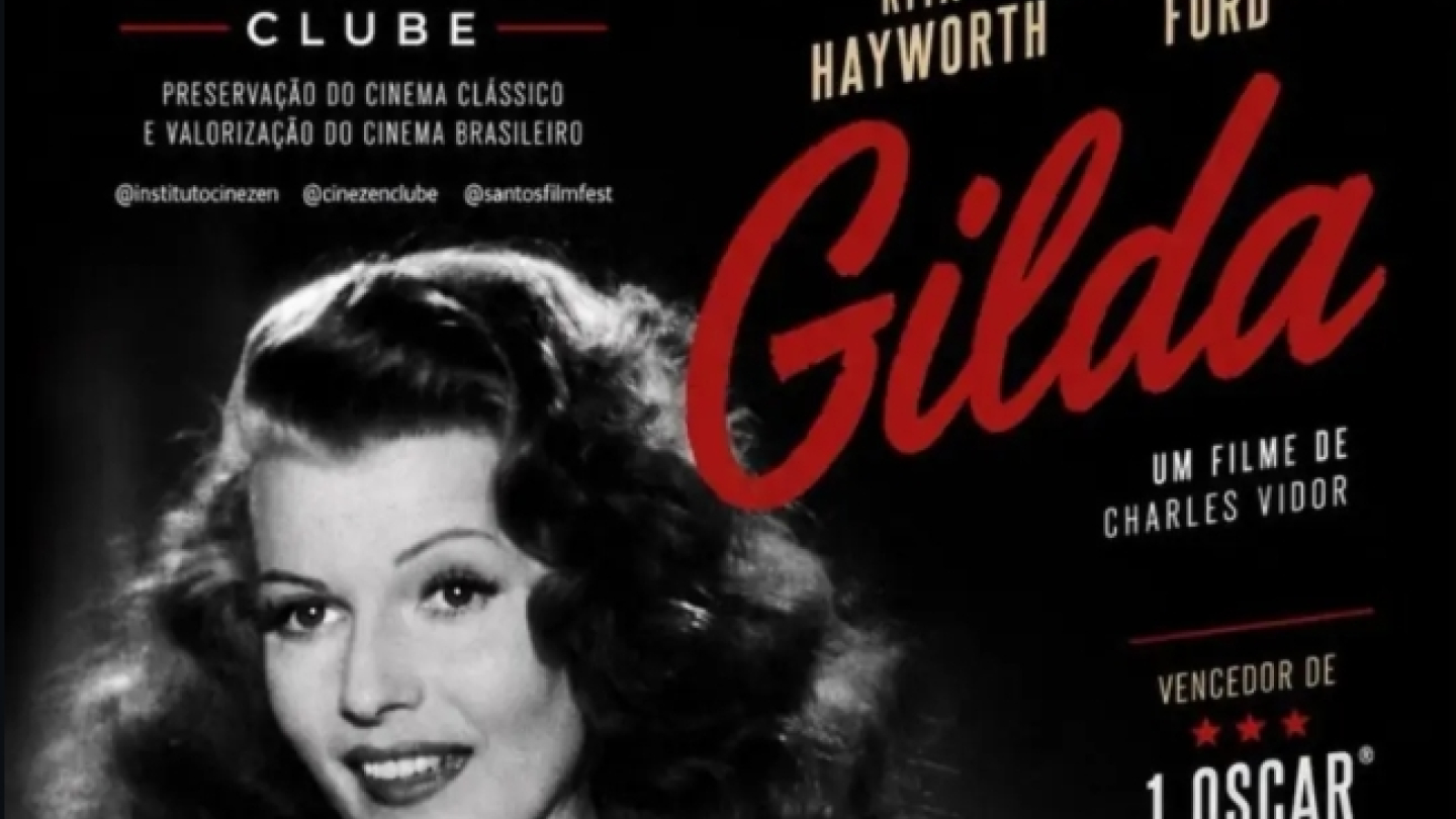 Cartaz de divulgação da exibição do clássico "Gilda", dirigido por Charles Vidor e estrelado por Rita Hayworth e Glenn Ford. A arte utiliza uma fotografia em preto e branco da protagonista em destaque, contrastando com o título em vermelho. O cartaz informa que a sessão acontece no dia 18 de julho, às 19h30, na Cinemateca de Santos, com entrada gratuita e sujeita à lotação. Também destaca atividades complementares, como vídeo introdutório, sorteio de cards temáticos exclusivos e material complementar dispon